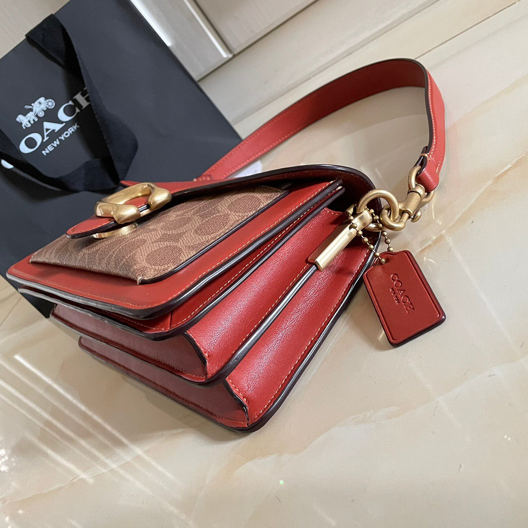 Authentic Co*ch Tabb*y Coated Canvas Signature in Tan Rust